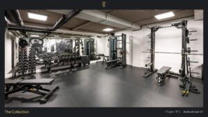 Modern gym with strength training equipment, including weights, benches, and resistance machines, at Stadhouderskade 85.