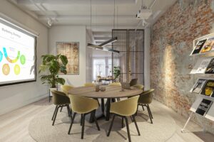 Moderne vergaderruimte aan het Rokin met ronde tafel, projectiescherm en industriële bakstenen muur.