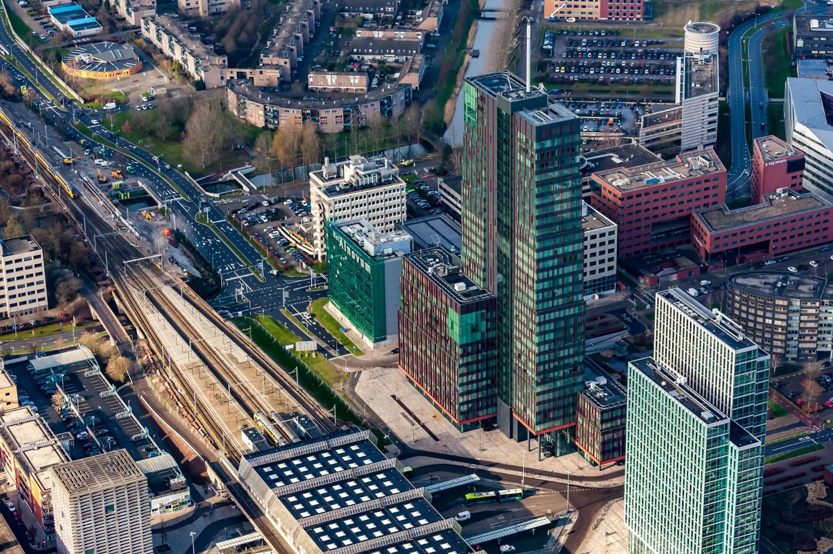 Aerial view of the modern high-rise buildings and surrounding infrastructure at P.J. Oudweg in Almere, Netherlands.