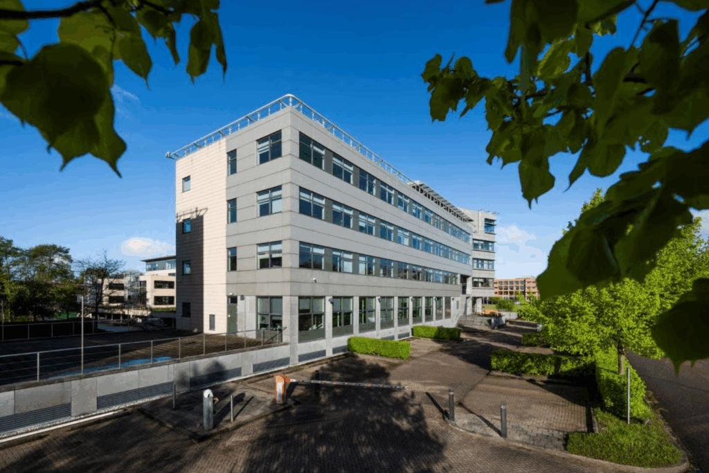 Modern office building on Boeing Avenue with surrounding greenery and blue sky.